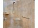 Neutral-toned shower stall with a corner seat, handheld showerhead, and safety bar at 164 Montoro Ln, Davenport, FL 33837