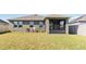 The backyard features a screened patio, privacy fence, and a well-maintained lawn at 1654 Chatsworth Cir, St Cloud, FL 34771