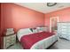 Cozy bedroom with tile floors, decorative bedding, and bedside tables at 1654 Chatsworth Cir, St Cloud, FL 34771
