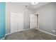 Neutral bedroom with gray carpet, closet, and doorway at 1654 Chatsworth Cir, St Cloud, FL 34771