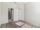 Neutral bedroom with gray carpet, closet, and doorway at 1654 Chatsworth Cir, St Cloud, FL 34771