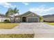 Charming one-story home with a well-manicured lawn and a lovely paver driveway at 1654 Chatsworth Cir, St Cloud, FL 34771