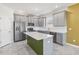 Kitchen features gray cabinetry, a stainless-steel appliance package, and a center island with white countertops at 1654 Chatsworth Cir, St Cloud, FL 34771