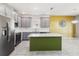 Modern kitchen with stainless steel appliances, gray cabinets, a large center island, and tile flooring at 1654 Chatsworth Cir, St Cloud, FL 34771