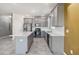 Well-equipped kitchen with gray cabinetry, a stainless-steel appliance package, and a large center island at 1654 Chatsworth Cir, St Cloud, FL 34771