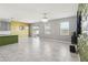 Open-concept living room featuring tile floors, windows and sliding glass doors at 1654 Chatsworth Cir, St Cloud, FL 34771