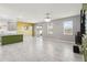 Bright living area boasts tile floors, pendant lighting, and access to the kitchen and outdoor space at 1654 Chatsworth Cir, St Cloud, FL 34771