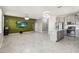 Open-concept kitchen and living space featuring modern tile and neutral paint at 1654 Chatsworth Cir, St Cloud, FL 34771