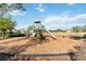 Community playground with slides and climbing area surrounded by wood chips, promoting outdoor fun and activity at 1654 Chatsworth Cir, St Cloud, FL 34771