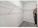 The walk-in closet offers ample storage space with wire shelving and gray carpet at 1654 Chatsworth Cir, St Cloud, FL 34771