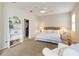 Inviting bedroom boasts a cozy atmosphere with carpet, neutral walls, and a walk-in closet at 1923 Lazy Oaks Loop, St Cloud, FL 34771