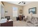 Home office features a wooden desk, comfortable chair, and large window with shutters at 1923 Lazy Oaks Loop, St Cloud, FL 34771