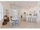 Eat-in kitchen with white cabinets, stainless appliances, and island with bar seating at 1923 Lazy Oaks Loop, St Cloud, FL 34771