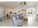 Bright living room showcases an open layout, connecting the kitchen, dining, and living spaces for a cohesive design at 1923 Lazy Oaks Loop, St Cloud, FL 34771