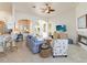 Spacious living room with an open floor plan, blending seamlessly with the kitchen and dining areas for easy entertaining at 1923 Lazy Oaks Loop, St Cloud, FL 34771