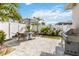 Paver patio features a stainless steel grill, outdoor seating, and well-maintained landscaping at 1923 Lazy Oaks Loop, St Cloud, FL 34771