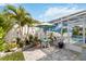 Enjoy this patio area, complete with a table, chairs, and a beautiful view of the pool at 1923 Lazy Oaks Loop, St Cloud, FL 34771