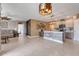 Spacious open concept living area with kitchen island and modern lighting at 194 Henry Steven Dr, Haines City, FL 33844