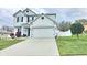 Charming two-story home with landscaped front yard and two-car garage at 2015 Barstow Ln, Dundee, FL 33838