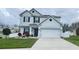 Charming two-story home with landscaped front yard and two-car garage at 2015 Barstow Ln, Dundee, FL 33838