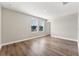 Bedroom featuring neutral paint, vinyl floors, windows, and a doorway to another room at 2017 Camden Loop, Davenport, FL 33837