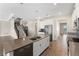 Spacious open kitchen with a large island, stainless steel appliances, and hardwood floors at 2017 Camden Loop, Davenport, FL 33837