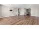 A spacious living room with wood floors and neutral walls at 2017 Camden Loop, Davenport, FL 33837