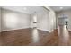 A spacious open-concept living area with light-filled room and hardwood flooring at 2017 Camden Loop, Davenport, FL 33837