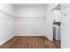 Walk-in closet with a washer and dryer, wire shelving and vinyl floors at 2017 Camden Loop, Davenport, FL 33837