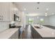 Modern kitchen with quartz countertops, stainless steel appliances and wood floors at 2238 Gold Dust Dr, Clermont, FL 34715
