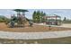 Community playground with mature trees, picnic shelter, and brick walkways at 2238 Gold Dust Dr, Clermont, FL 34715