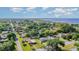 Scenic aerial view of a quaint neighborhood with mature trees, showcasing a cozy home at 224 Pennsylvania Ave, St Cloud, FL 34769