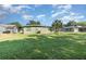 Spacious backyard with well-manicured lawn surrounding a cozy home at 224 Pennsylvania Ave, St Cloud, FL 34769
