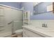 Bright bathroom with shower, toilet, sink and storage cabinet at 224 Pennsylvania Ave, St Cloud, FL 34769