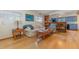 Cozy living room featuring hardwood floors, a comfortable couch, and a wooden coffee table at 224 Pennsylvania Ave, St Cloud, FL 34769