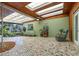 Sunroom with mosaic tile floor, wood-paneled ceiling, and multiple skylights at 224 Pennsylvania Ave, St Cloud, FL 34769