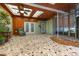 Enclosed sunroom with tile flooring, wood paneling, skylights, and ceiling fans at 224 Pennsylvania Ave, St Cloud, FL 34769