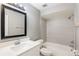 Bathroom featuring vanity with white countertop and tub and shower combo at 2305 St Marteen Ct # 2305, Kissimmee, FL 34741