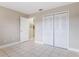 Bedroom with tile flooring, closet, and attached bathroom access at 2305 St Marteen Ct # 2305, Kissimmee, FL 34741