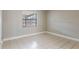 Bedroom featuring tile flooring and a window at 2305 St Marteen Ct # 2305, Kissimmee, FL 34741