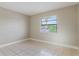 Bright bedroom with ceramic tile flooring, natural light, and neutral paint at 2305 St Marteen Ct # 2305, Kissimmee, FL 34741