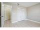 Bedroom featuring tile flooring and closet at 2305 St Marteen Ct # 2305, Kissimmee, FL 34741