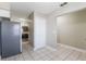 Well-lit kitchen featuring stainless steel appliances, tile flooring, and ample cabinet space at 2305 St Marteen Ct # 2305, Kissimmee, FL 34741