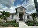 Community Building with well-manicured landscaping and decorative stone accents at 2789 Pleasant Cypress Cir, Kissimmee, FL 34741