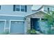 Charming two-story home with stone accents and a well-maintained front yard at 2789 Pleasant Cypress Cir, Kissimmee, FL 34741