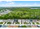 Aerial view of the neighborhood and green space behind the homes at 283 Willow View Dr, Davenport, FL 33896