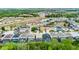 Aerial view of a residential neighborhood with many homes having pools at 283 Willow View Dr, Davenport, FL 33896