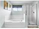 Bathroom featuring a shower and a soaking tub with tile surround at 283 Willow View Dr, Davenport, FL 33896