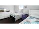 Twin beds with accent pillows and dark carpet at 283 Willow View Dr, Davenport, FL 33896