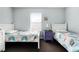 Neutral bedroom with two beds, twin beds, and dark carpet at 283 Willow View Dr, Davenport, FL 33896